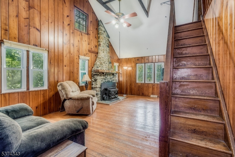 114 Pocantecs Road Vernon, NJ 07422 - Photo 8 of 20 a living room with furniture and a fireplace