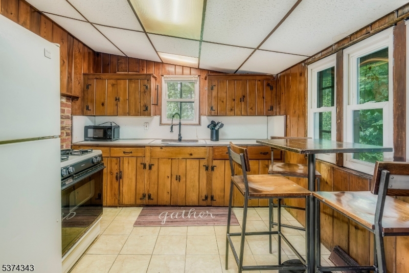 114 Pocantecs Road Vernon, NJ 07422 - Photo 9 of 20 a kitchen with stainless steel appliances granite countertop a sink and a refrigerator