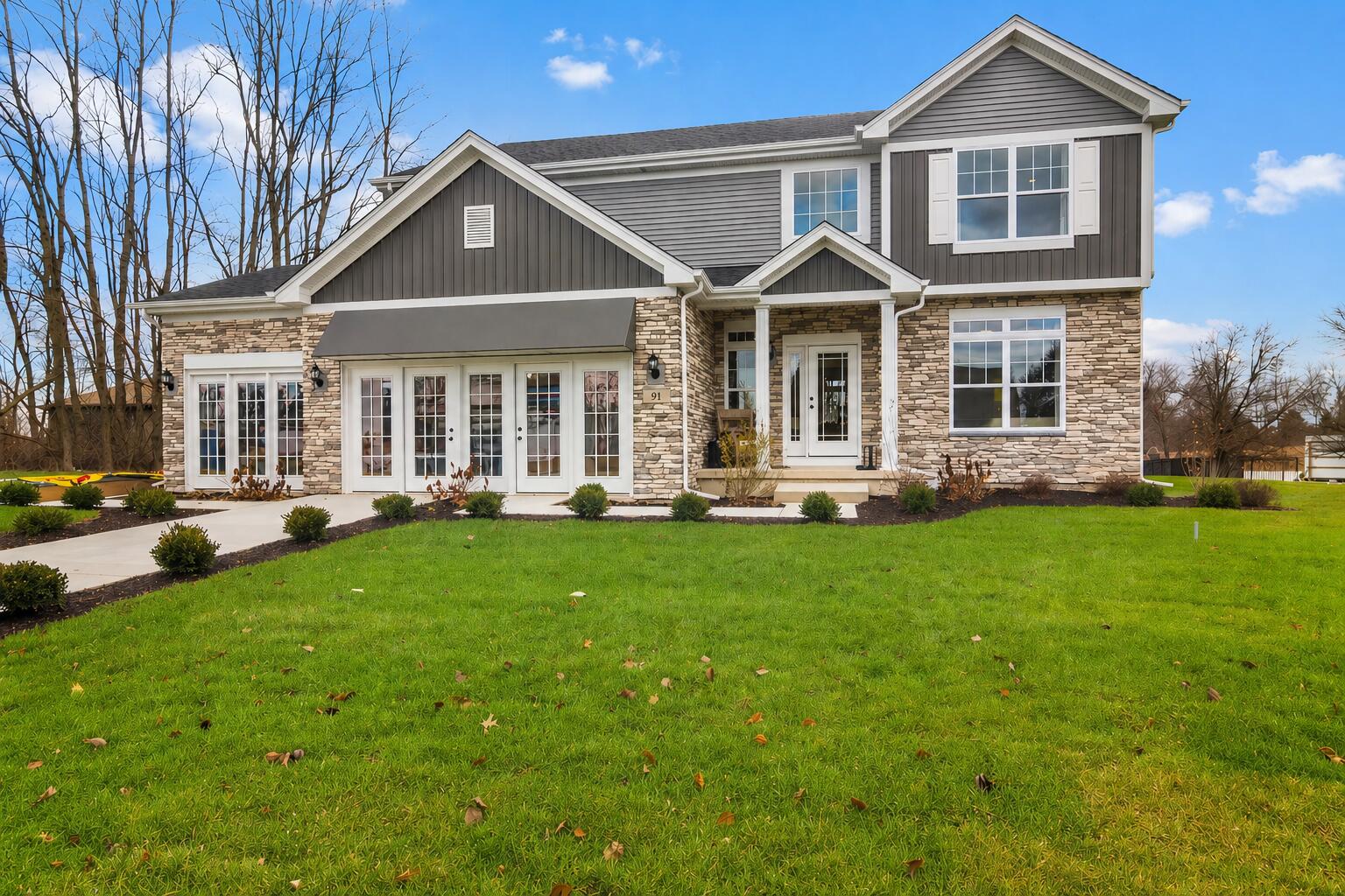 91 Bergamo Lane Crown Point, IN 46307 - Photo 1 of 29 a front view of a house with a yard