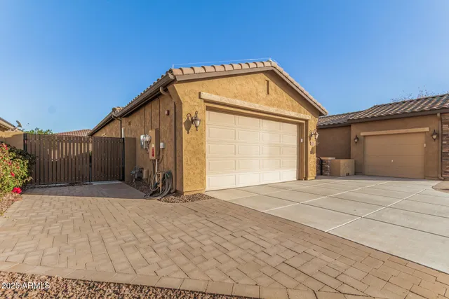 a view of garage with wooden fence