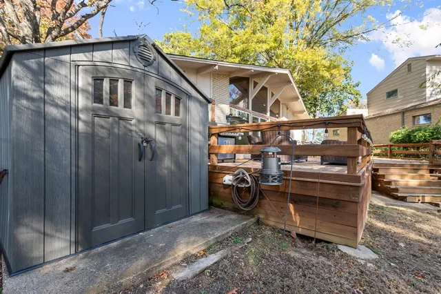 a view of a blue house with a outdoor space