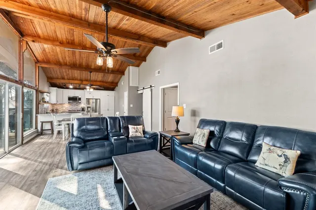 a living room with furniture and a window
