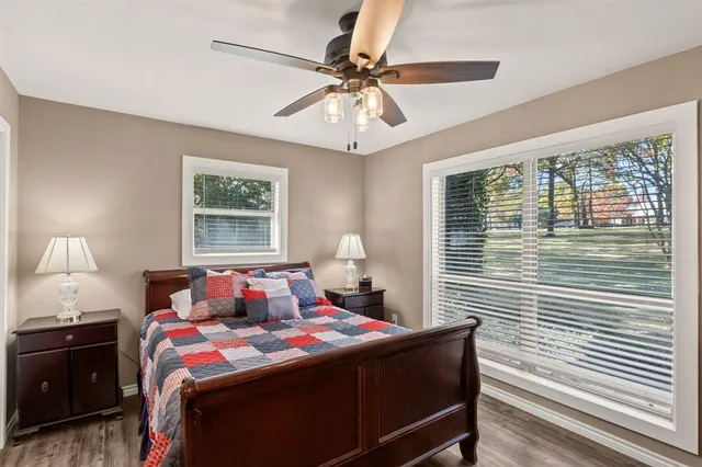 a bedroom with a bed and window
