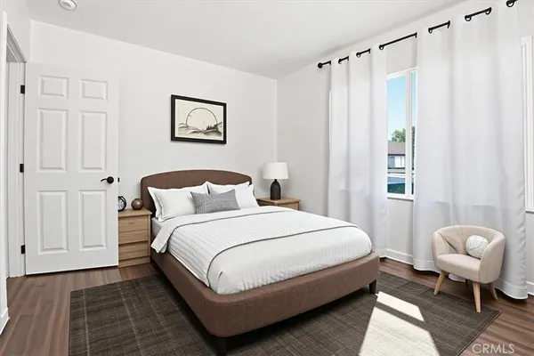 a bedroom with a bed and a couch