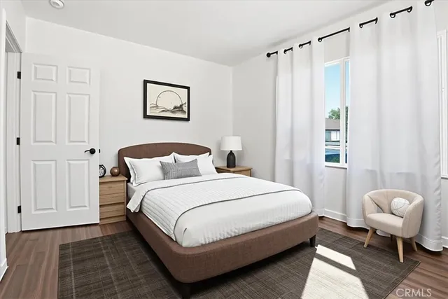 a bedroom with a bed and a couch