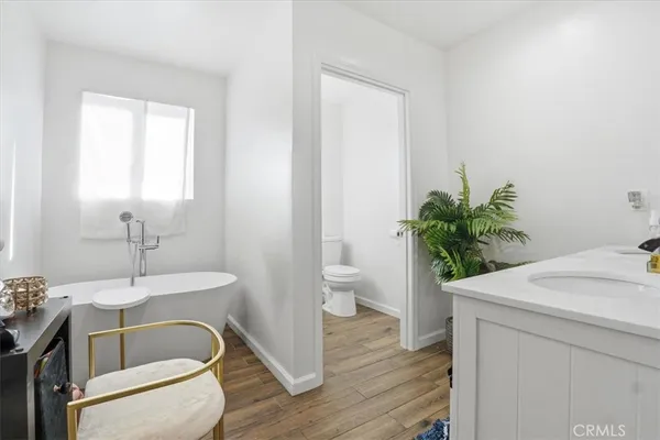 a bathroom with a sink and toilet