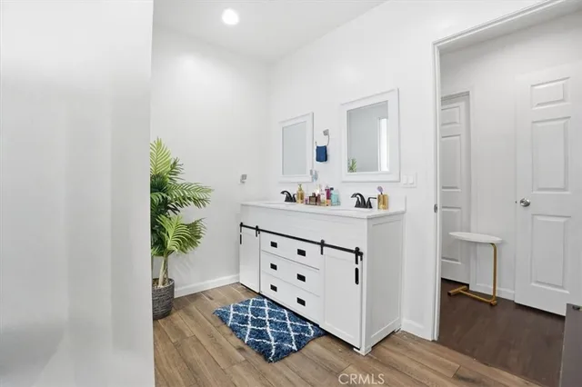 a room with furniture and a potted plant