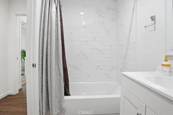 a bathroom with a bathtub and a shower