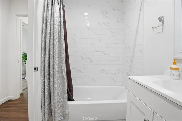 a bathroom with a bathtub and a shower