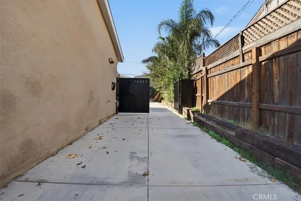 a view of a entrance gate with wooden fence