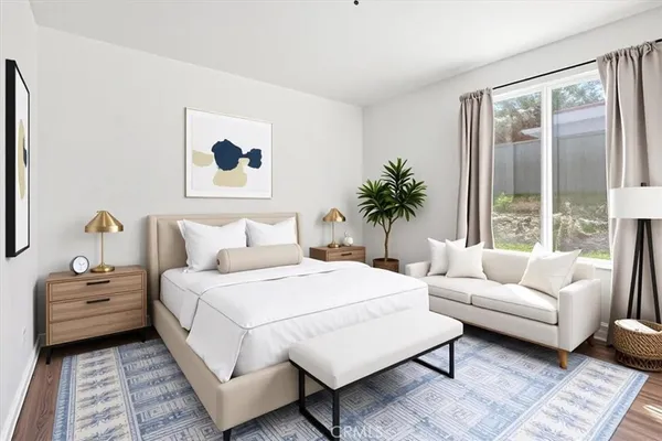 a bedroom with a large bed and a couch