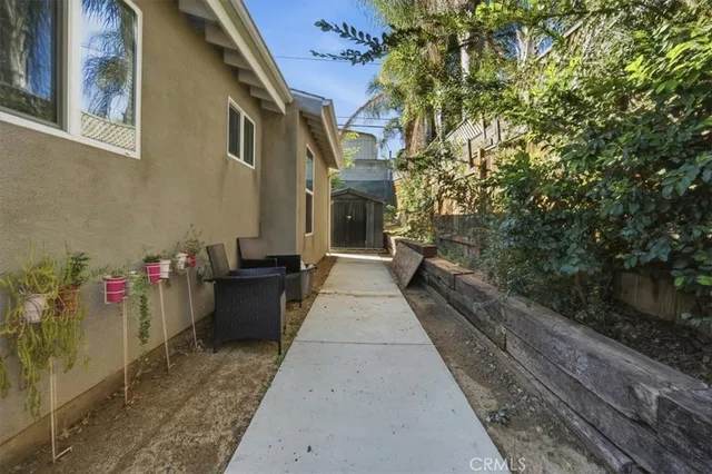 a view of a pathway with a backyard