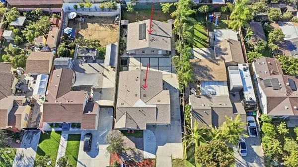 an aerial view of residential houses with outdoor space