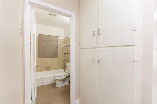 a bathroom with a granite countertop sink