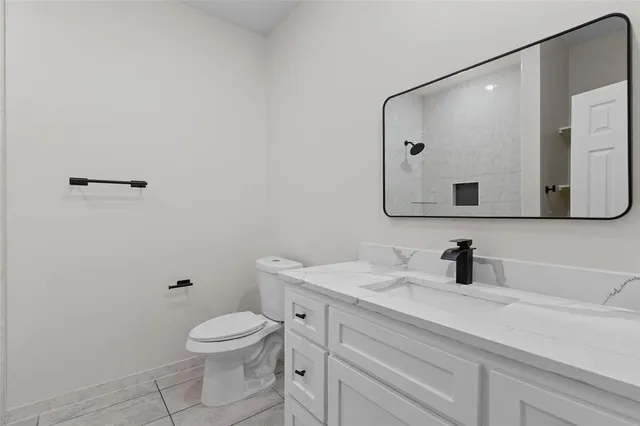 an empty room with a ceiling fan and window