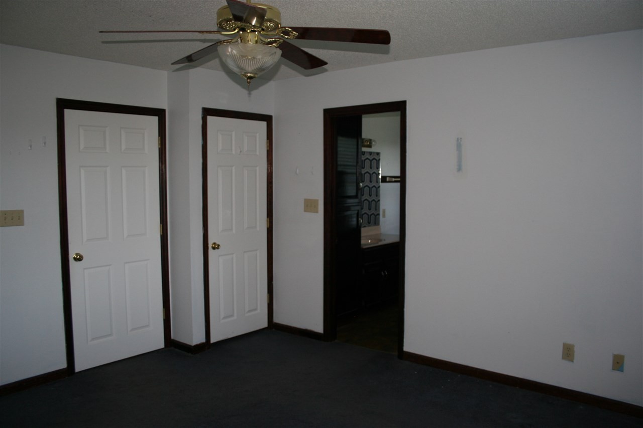 400 Dean Drive Northwest Georgetown, TN 37336 - Photo 14 of 38 an empty room with closet and a chandelier fan