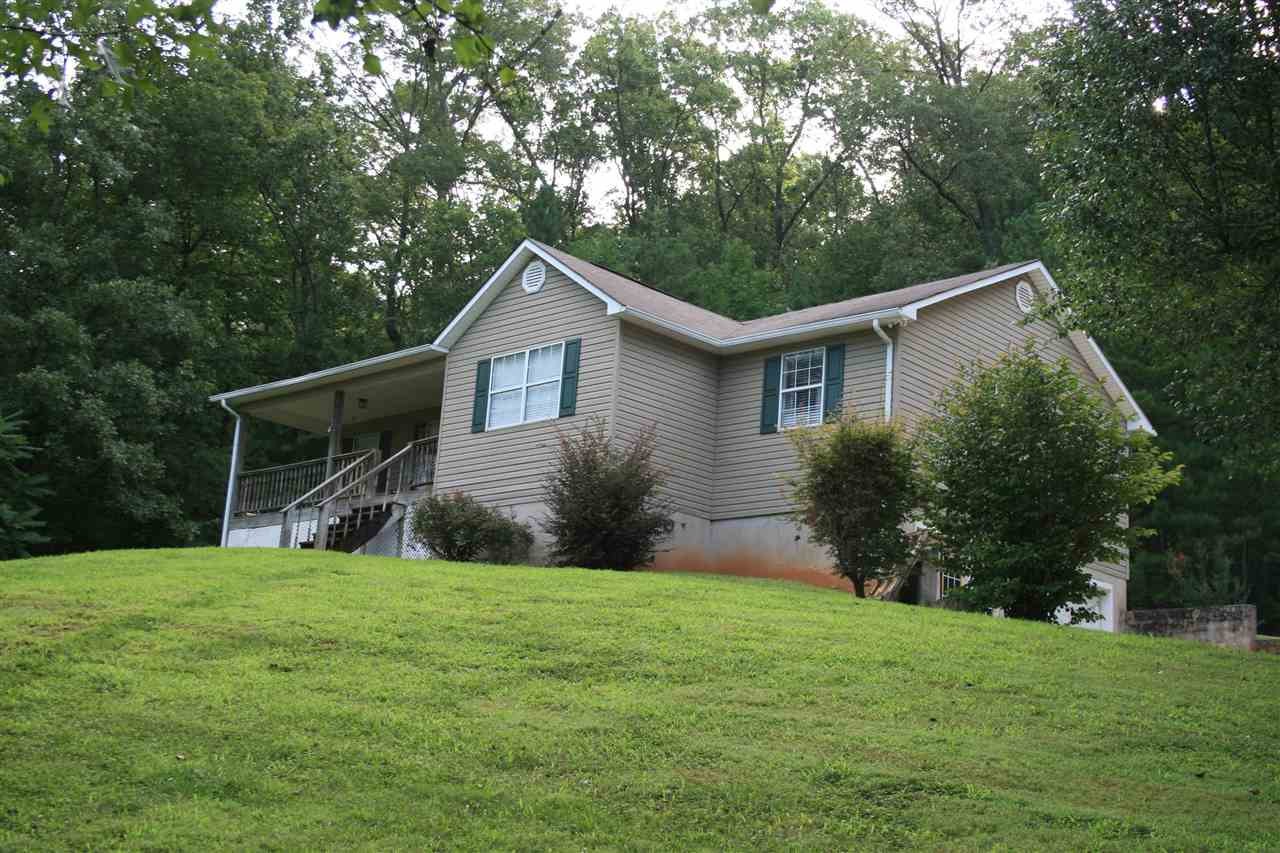 400 Dean Drive Northwest Georgetown, TN 37336 - Photo 2 of 38 a view of a yard in front of a house with plants and large tree