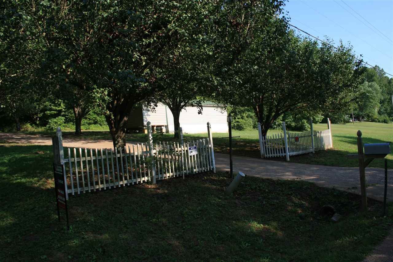 400 Dean Drive Northwest Georgetown, TN 37336 - Photo 25 of 38 a view of a backyard with wooden fence and a large tree