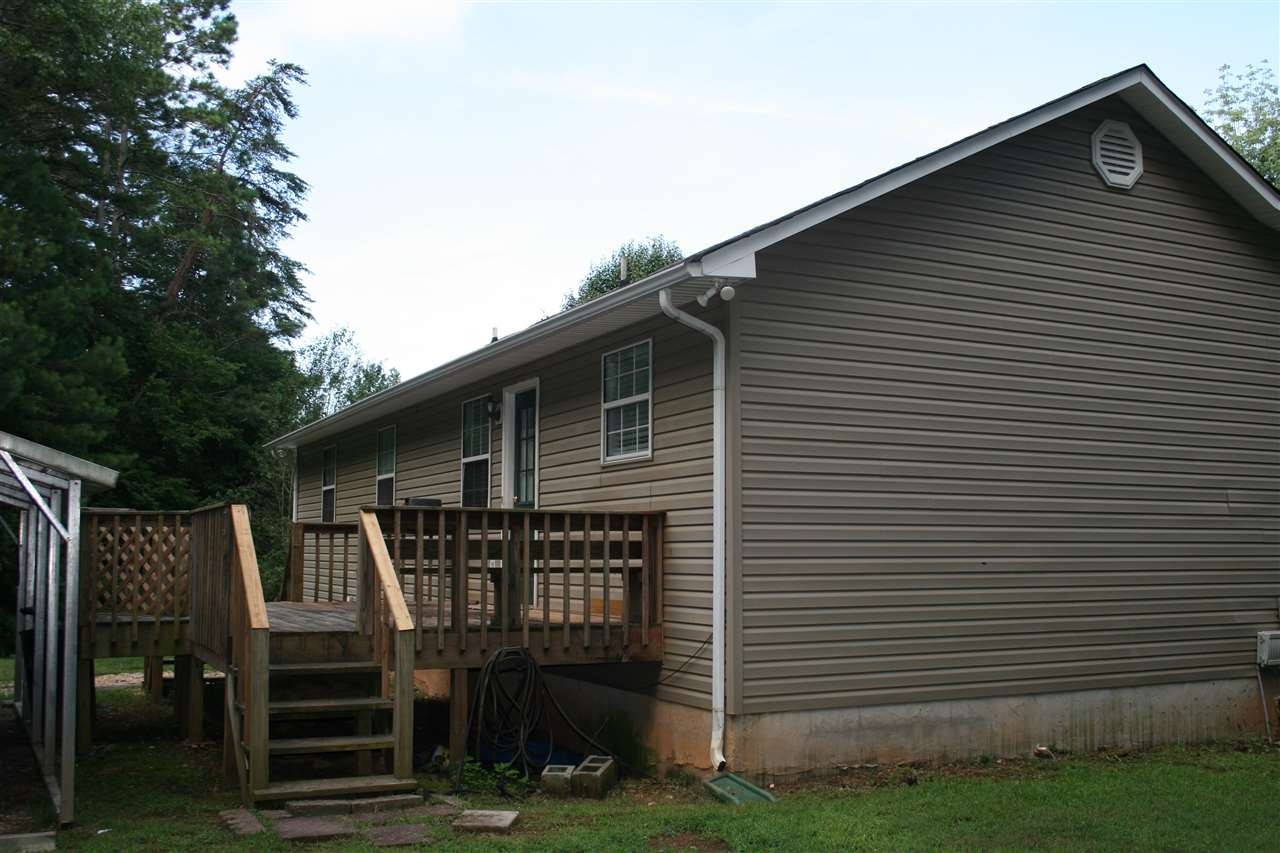 400 Dean Drive Northwest Georgetown, TN 37336 - Photo 26 of 38 a front view of a house with barbeque and wooden fence