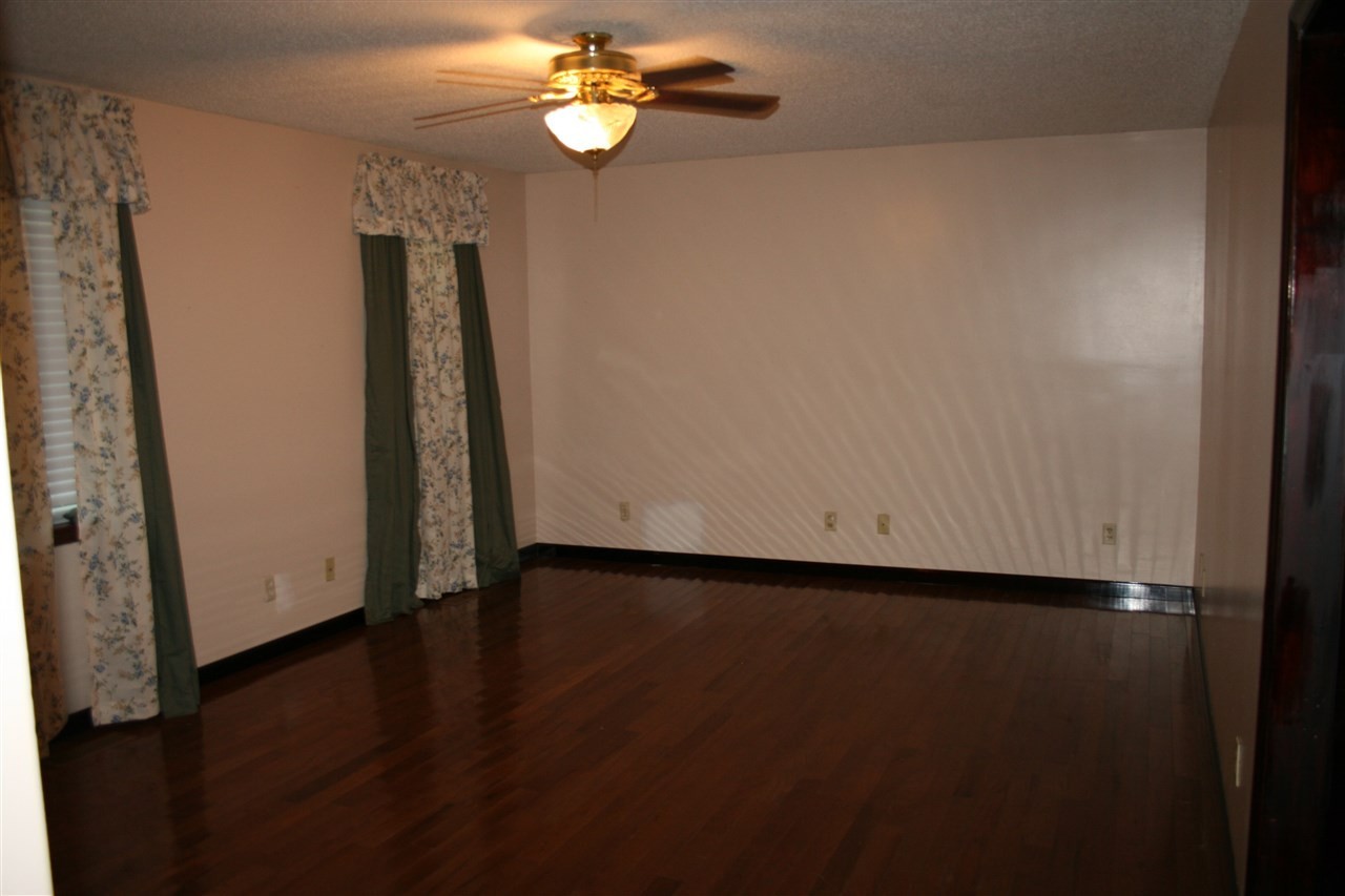 400 Dean Drive Northwest Georgetown, TN 37336 - Photo 5 of 38 an empty room with wooden floor and windows