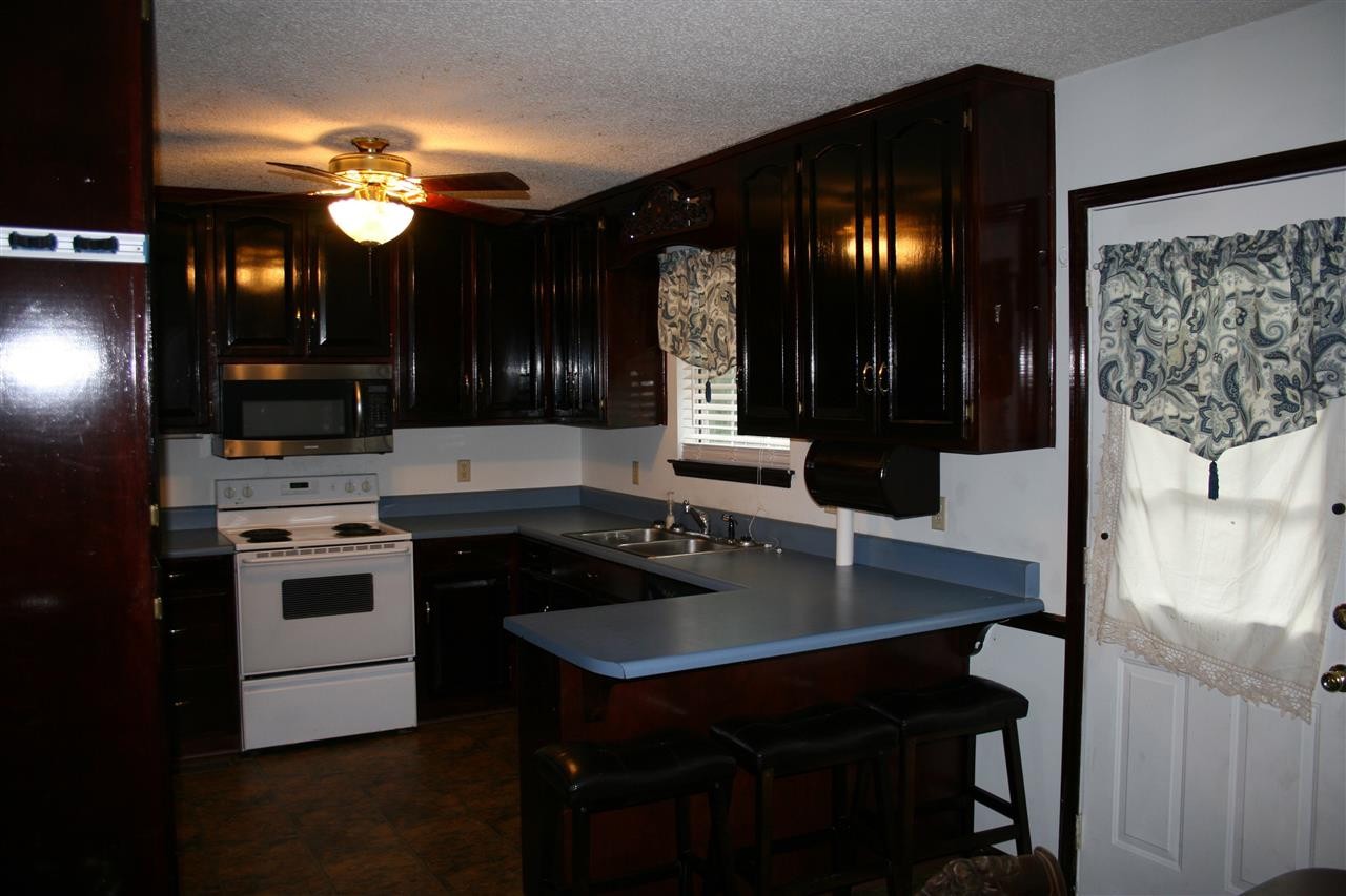400 Dean Drive Northwest Georgetown, TN 37336 - Photo 8 of 38 a kitchen with a counter space cabinets and appliances