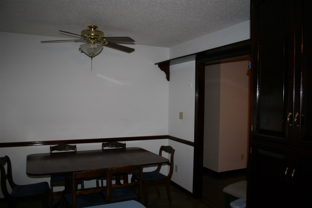 400 Dean Drive Northwest Georgetown, TN 37336 - Photo 9 of 38 a room with a table chairs and a wooden floor