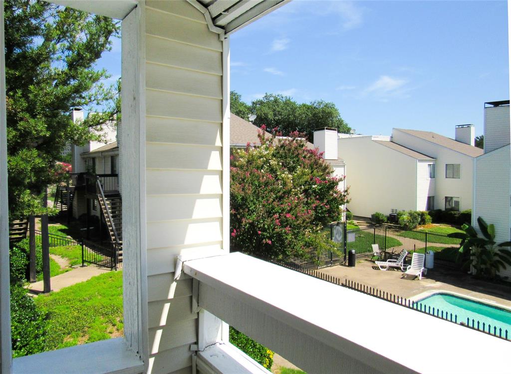 7431 Holly Hill Drive, Unit 216 Dallas, TX 75231 - Photo 15 of 19 a view of a yard in front of a house