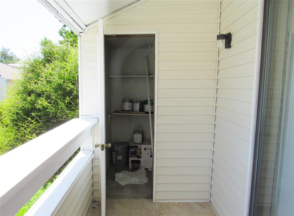 7431 Holly Hill Drive, Unit 216 Dallas, TX 75231 - Photo 16 of 19 a view of balcony and workspace