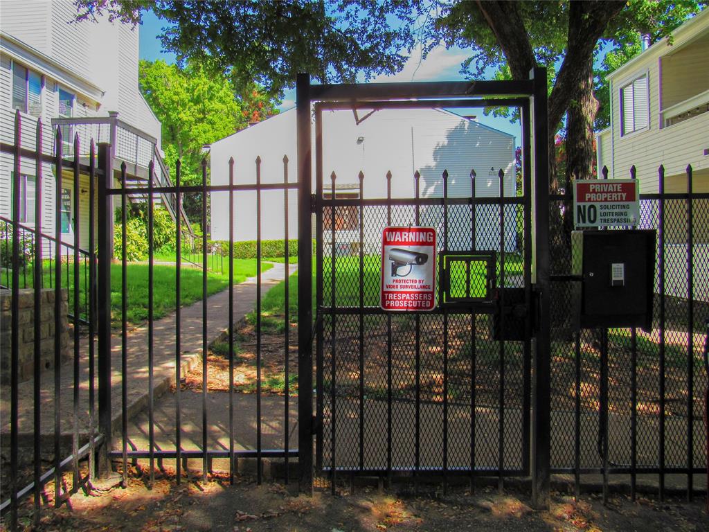 7431 Holly Hill Drive, Unit 216 Dallas, TX 75231 - Photo 2 of 19 a view of a building from a balcony