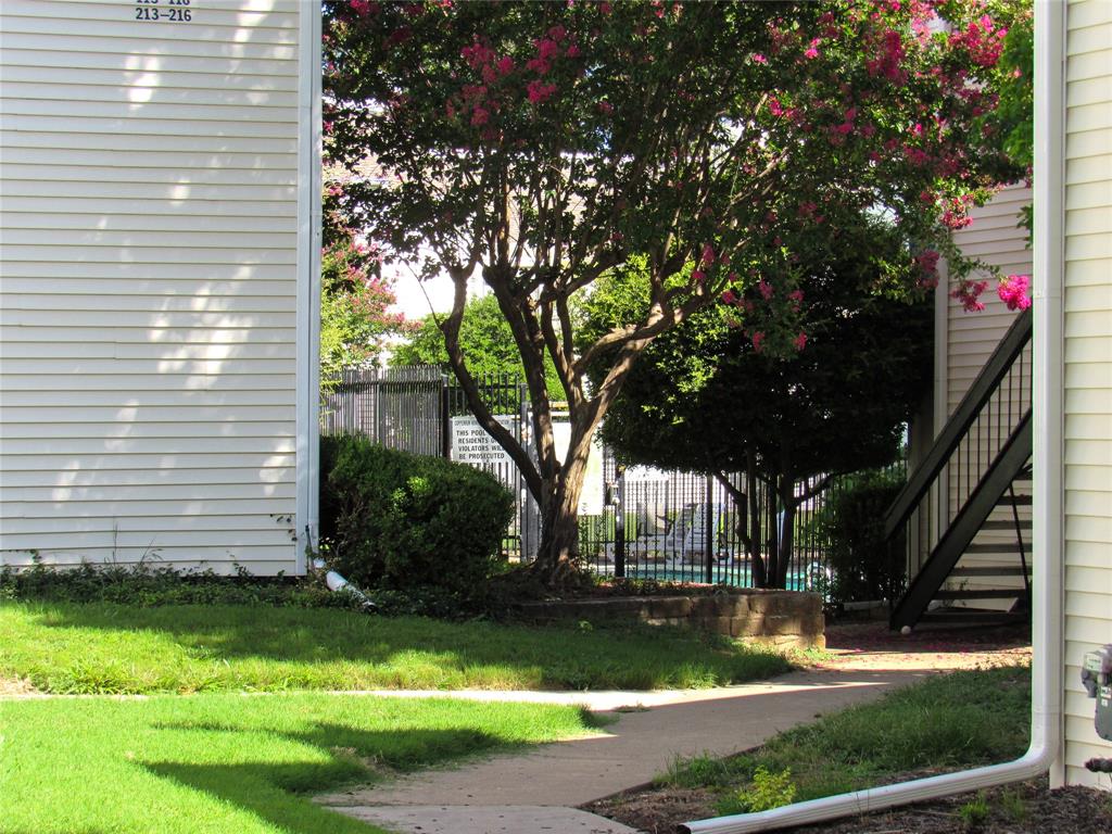 7431 Holly Hill Drive, Unit 216 Dallas, TX 75231 - Photo 3 of 19 a view of a yard in front of house