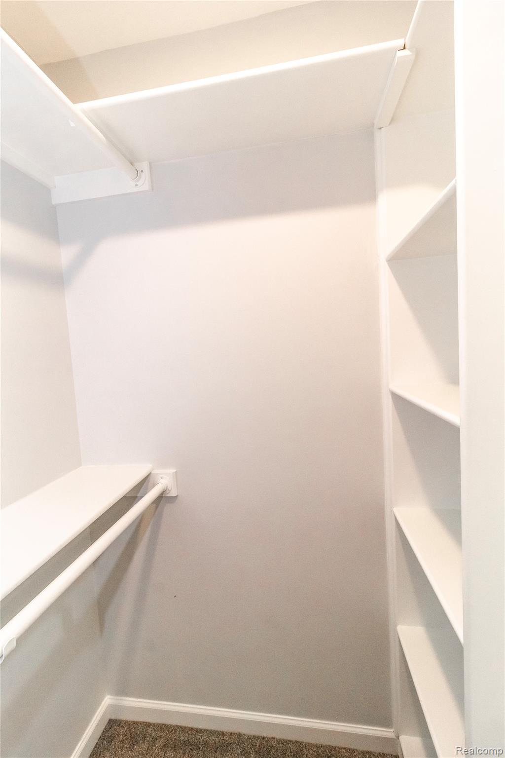 5155 Coldwater Road Lapeer, MI 48446 - Photo 9 of 24 Walk in closet featuring dark carpet