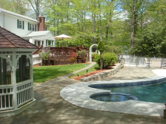 196 Mayapple Road Stamford, CT 06903 - Photo 1 of 1 a view of a house with backyard and porch