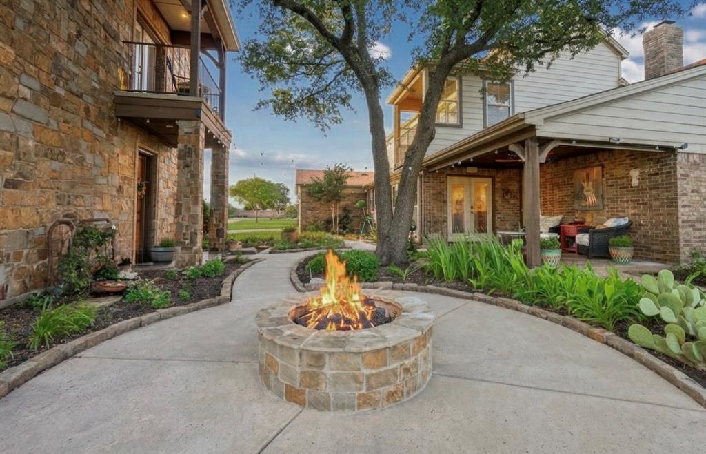 222 Bayne Road Haslet, TX 76052 - Photo 6 of 40 Entertaining area with built in fire pit and covered back porch