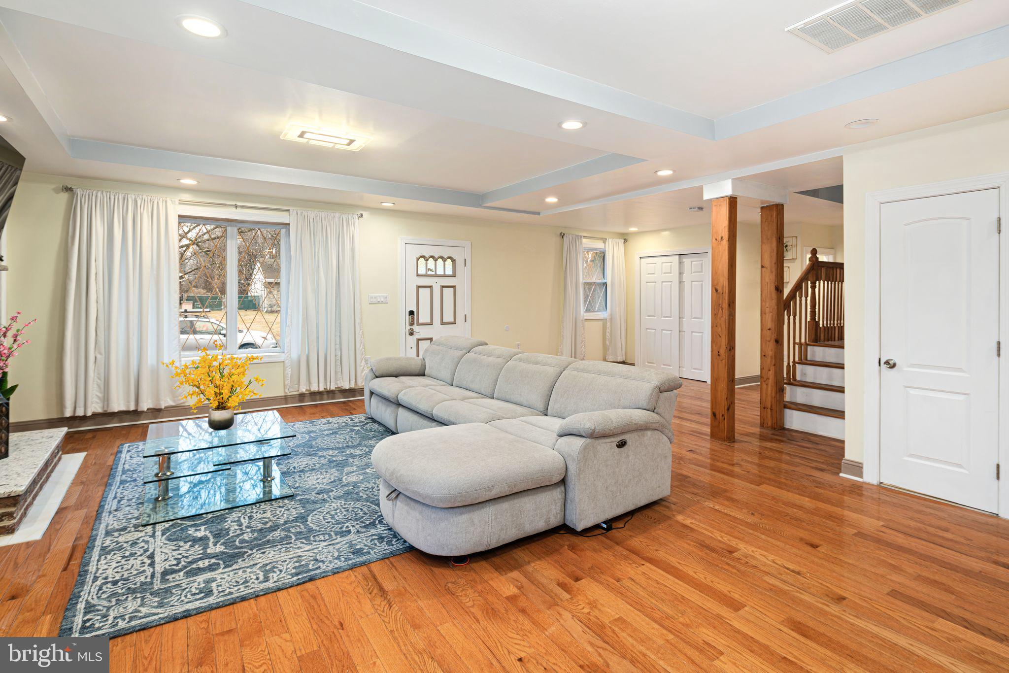 1034 Excelsior Drive Upper Chichester, PA 19014 - Photo 12 of 33 a living room with furniture and wooden floor