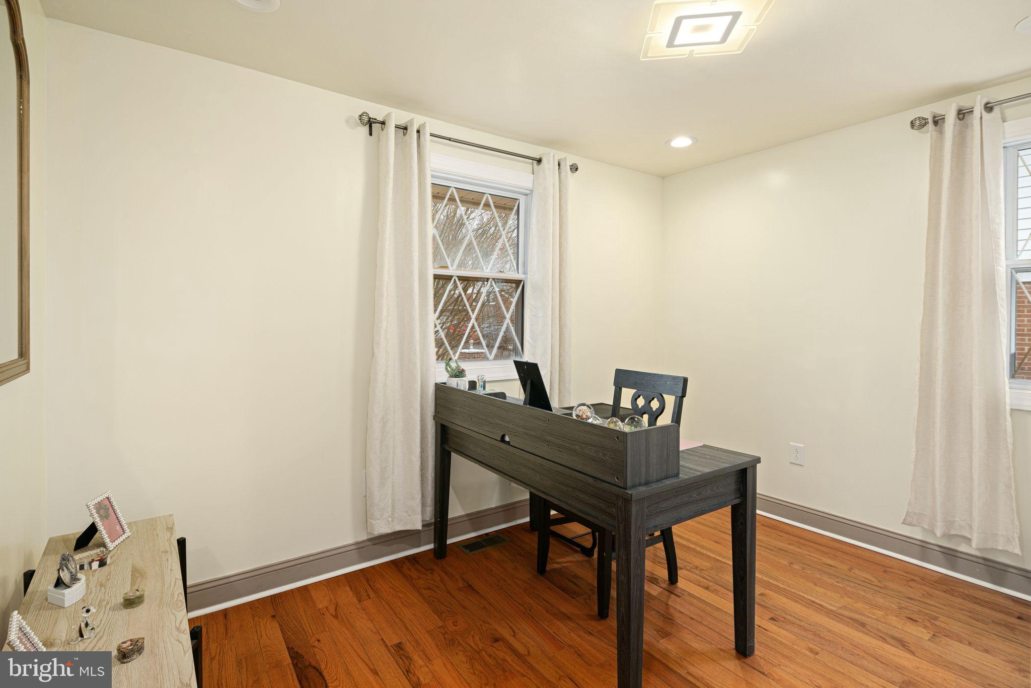 1034 Excelsior Drive Upper Chichester, PA 19014 - Photo 14 of 33 a workspace with furniture and wooden floor