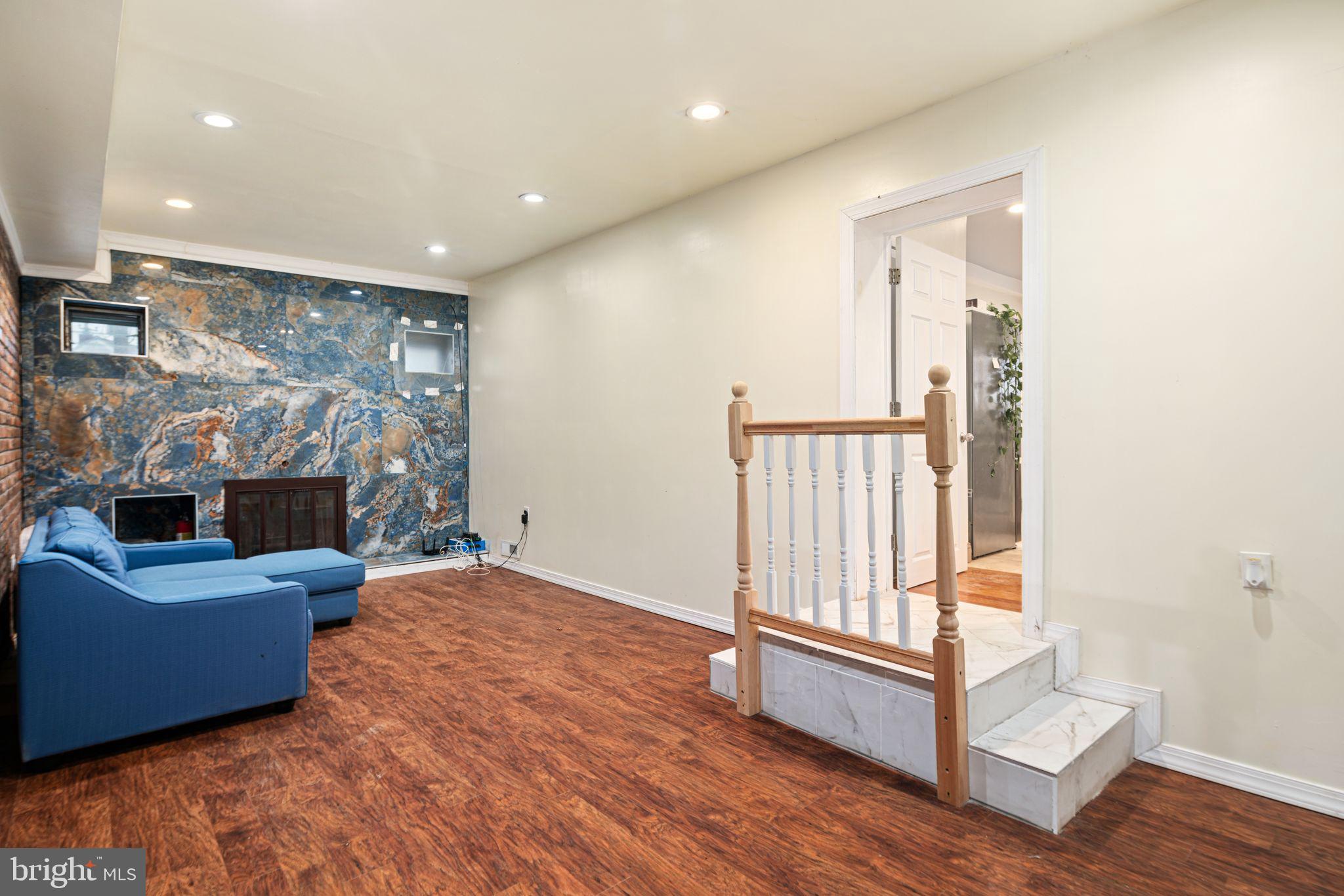 1034 Excelsior Drive Upper Chichester, PA 19014 - Photo 18 of 33 a living room with furniture and a flat screen tv