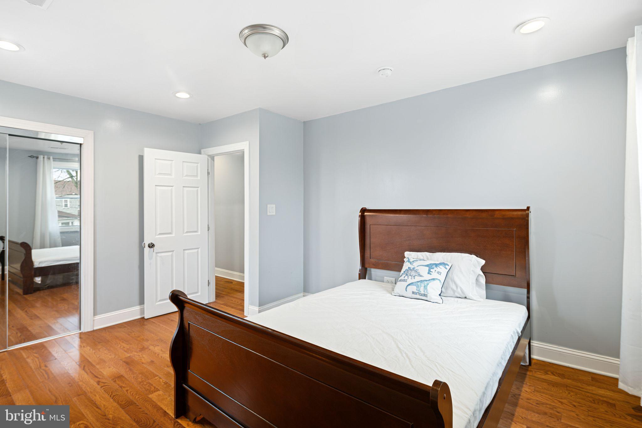 1034 Excelsior Drive Upper Chichester, PA 19014 - Photo 29 of 33 a bedroom with a bed and wooden floor