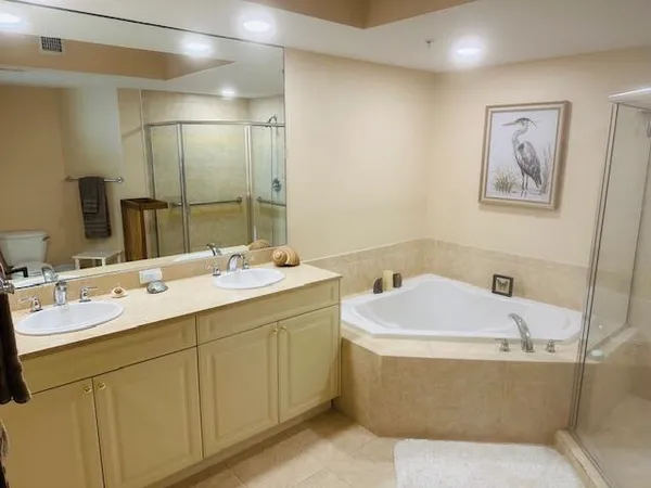 a view of a chairs and table in backyard