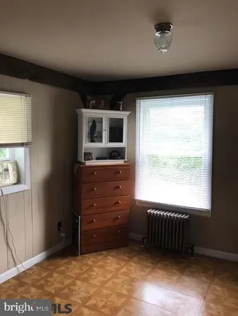 a room with furniture and a flat screen tv