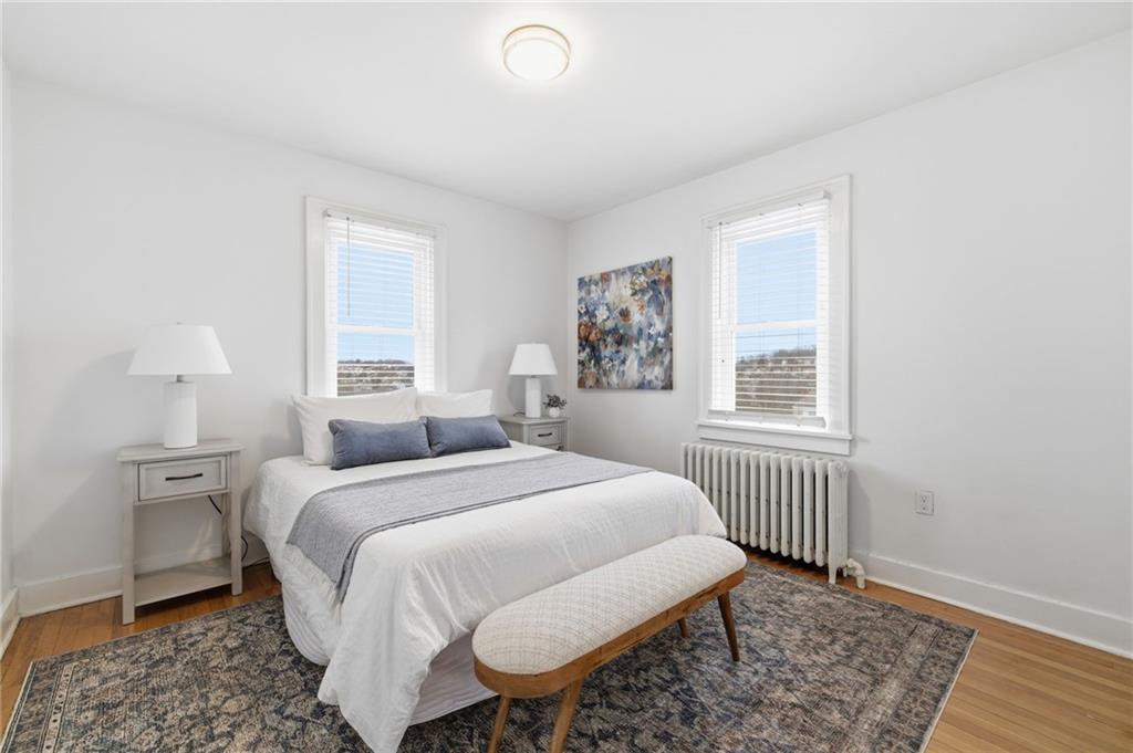 8 Esther Street Pittsburgh, PA 15227 - Photo 13 of 36 a bedroom with a bed and wooden floor