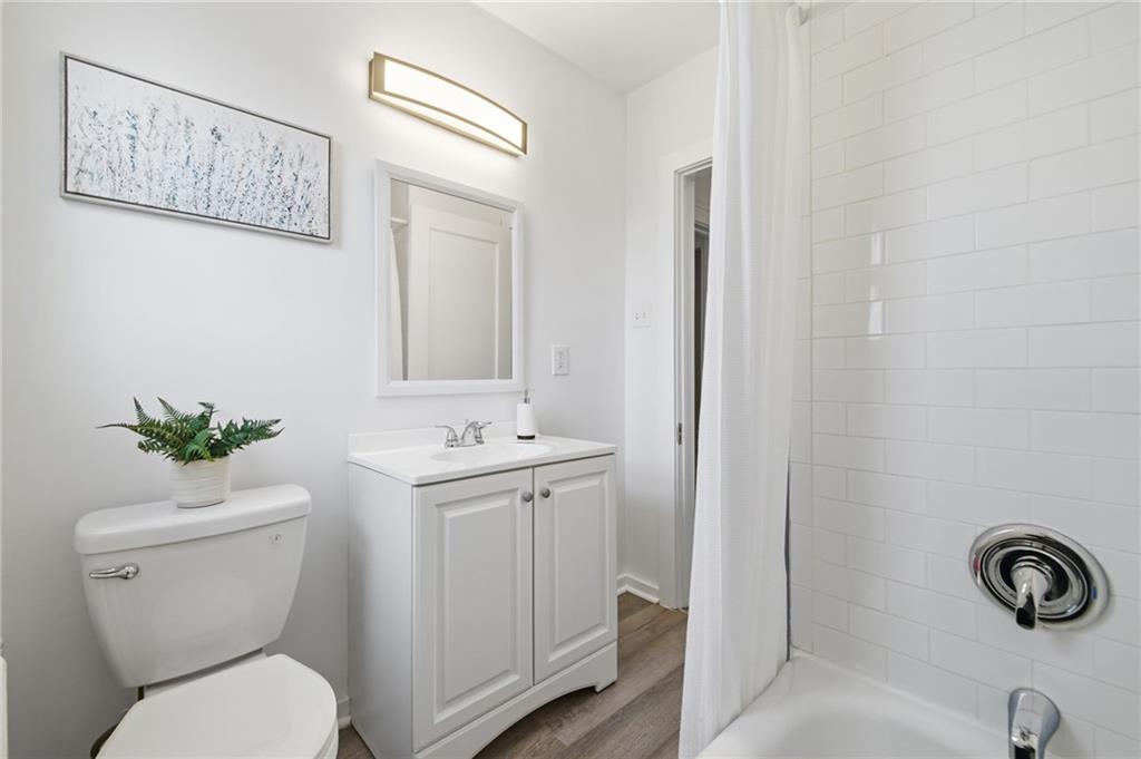 8 Esther Street Pittsburgh, PA 15227 - Photo 16 of 36 a bathroom with a toilet a sink and mirror