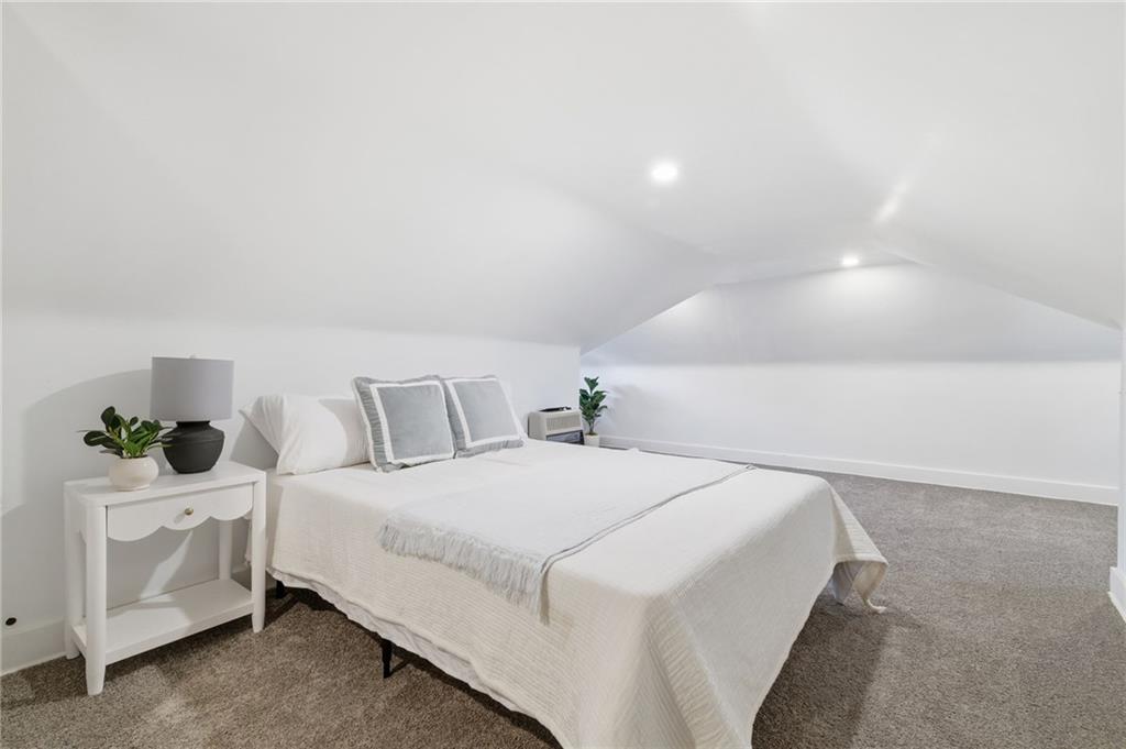 8 Esther Street Pittsburgh, PA 15227 - Photo 19 of 36 a bedroom with a bed and potted plants