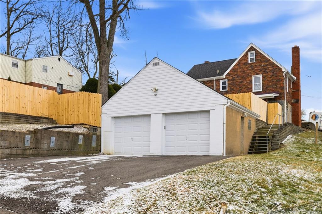 8 Esther Street Pittsburgh, PA 15227 - Photo 29 of 36 a front view of a house with a yard and garage