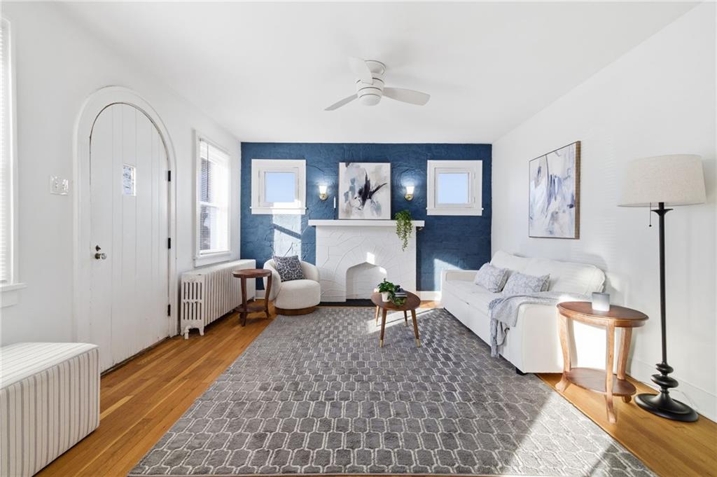 8 Esther Street Pittsburgh, PA 15227 - Photo 4 of 36 a living room with furniture and a fireplace