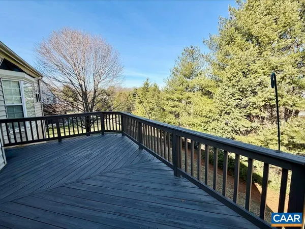 a view of balcony with wooden floor