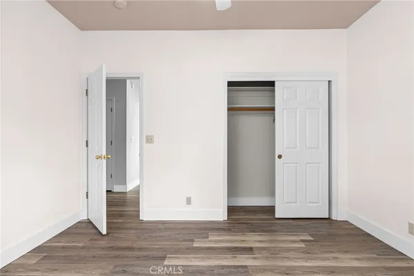 a view of a livingroom with wooden floor