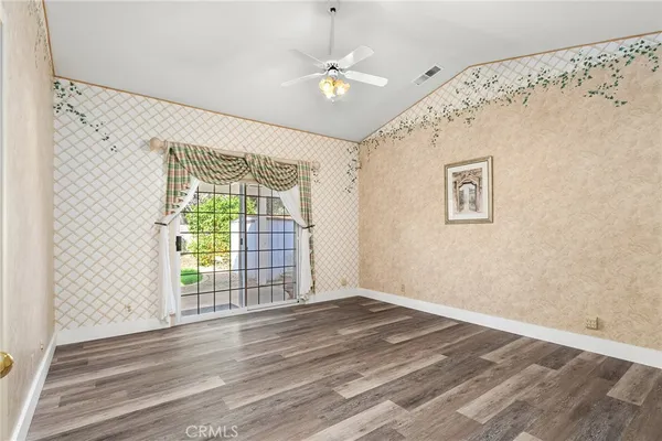a spacious bathroom with a double vanity sink toilet mirror and bathtub