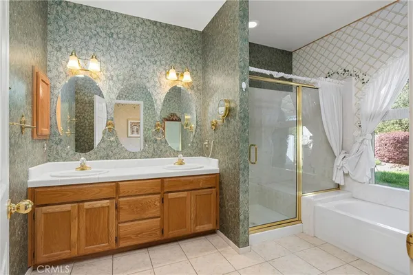 a bathroom with a tub and shower