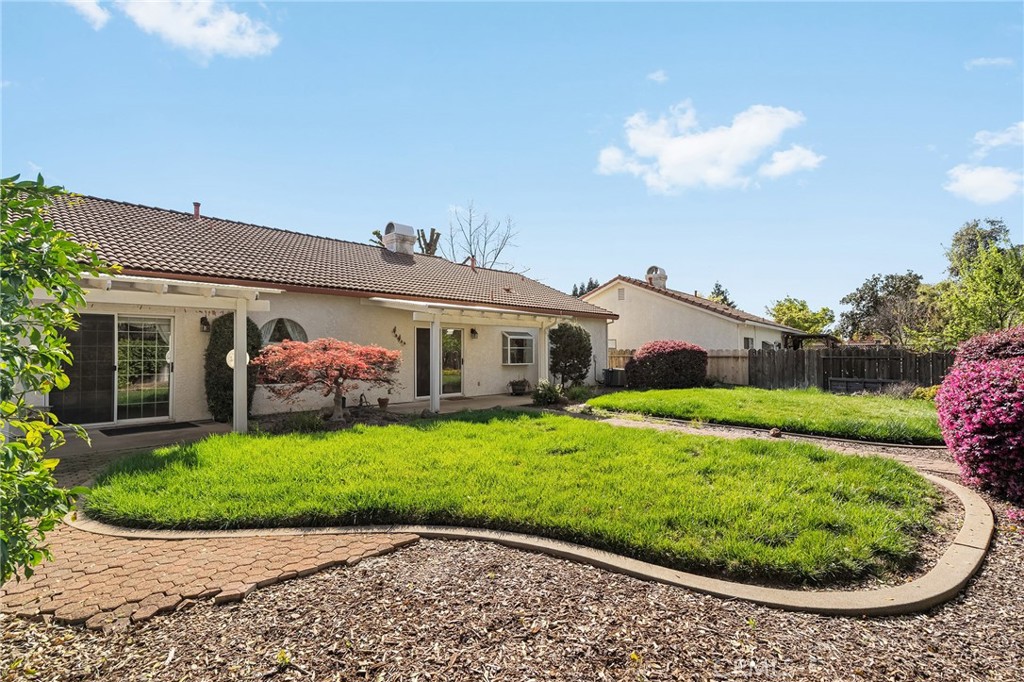 378 Picholine Way Chico, CA 95928 - Photo 36 of 52 a view of a house with a backyard and a garden