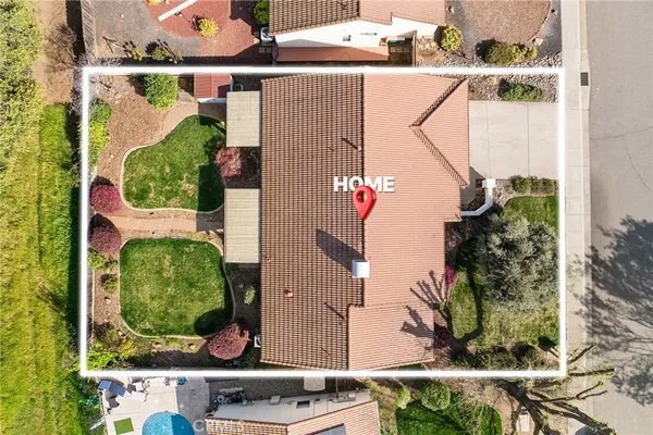 an aerial view of multi story residential apartment building with yard